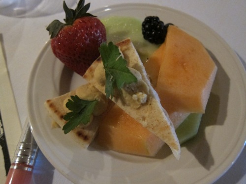 plate with fruit and hummus